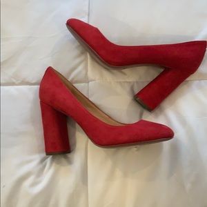 Red suede Coach pumps